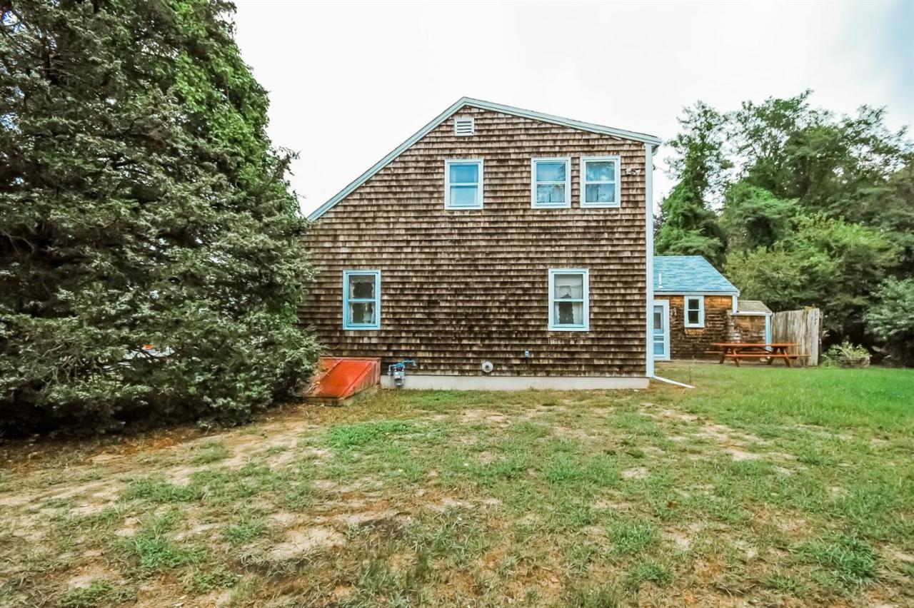 315 Samoset Road Eastham, MA 02642 - Photo 4 of 28 a front view of a house with an outdoor space