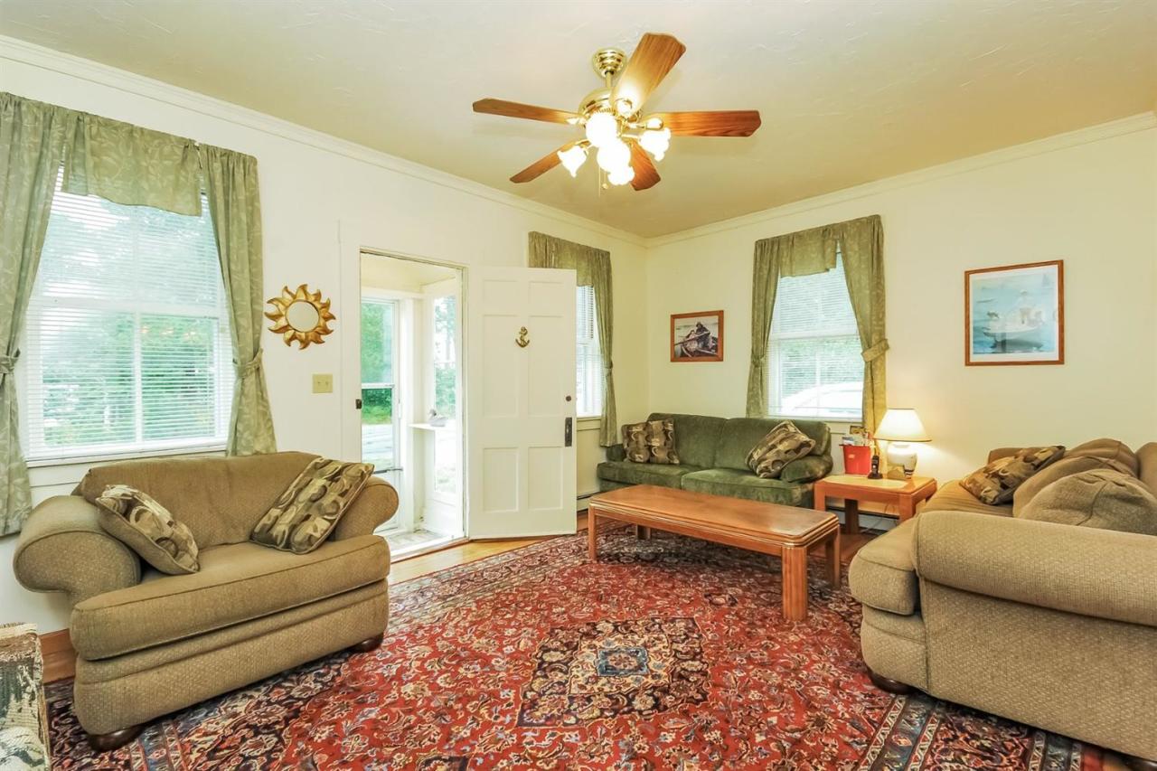 315 Samoset Road Eastham, MA 02642 - Photo 6 of 28 a living room with furniture and a large window