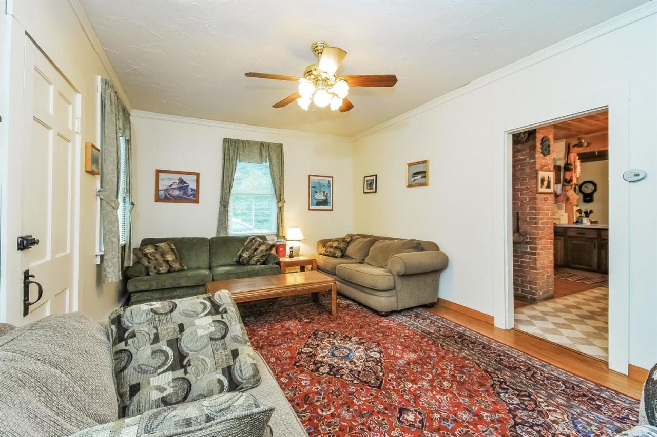 315 Samoset Road Eastham, MA 02642 - Photo 7 of 28 a living room with furniture and a rug