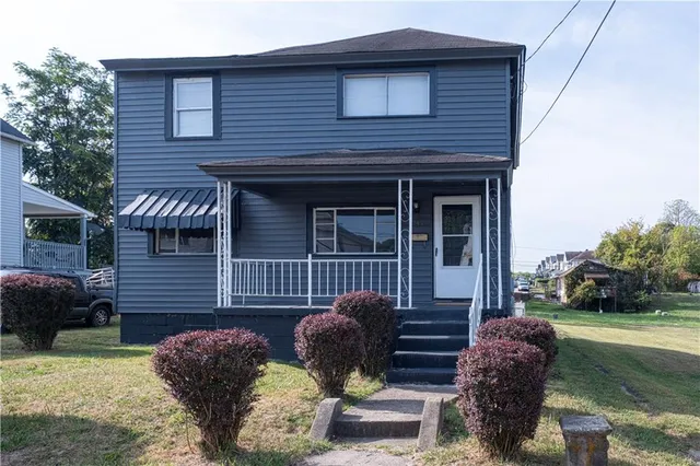 a front view of a house with patio