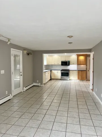 a view of a living room with a large window