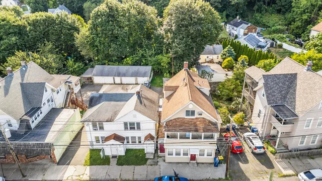 an aerial view of residential house with outdoor space and parking