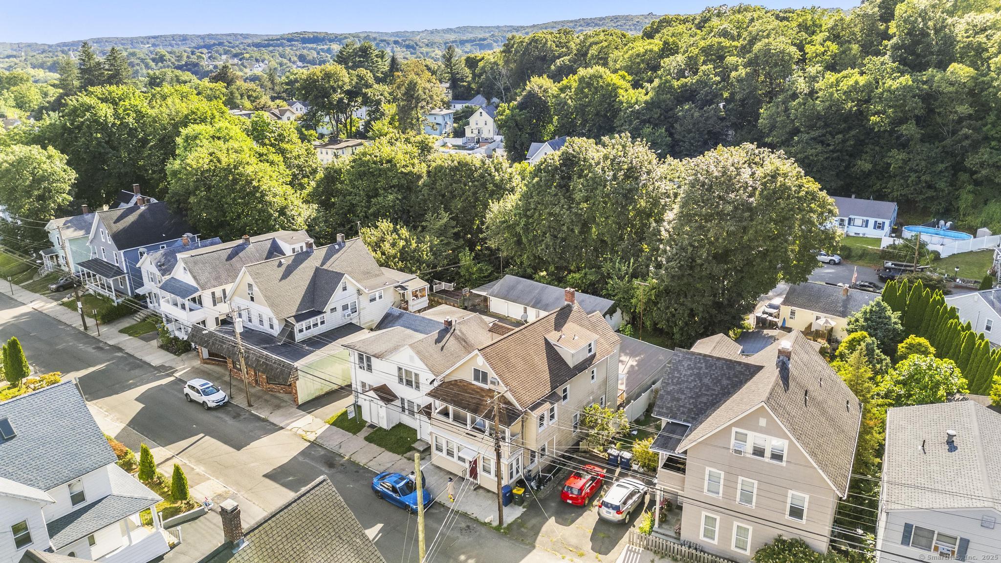 121 North State Street Ansonia, CT 06401 - Photo 14 of 37 an aerial view of a house with a yard basket ball court and outdoor seating