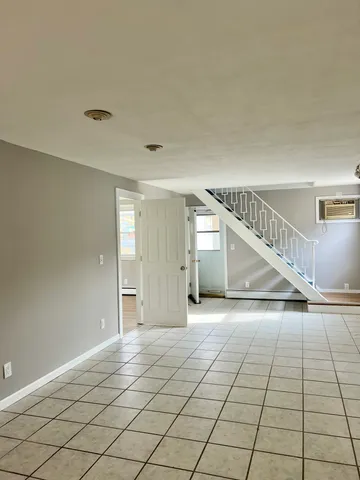 a large kitchen with stainless steel appliances granite countertop a stove a sink and a refrigerator