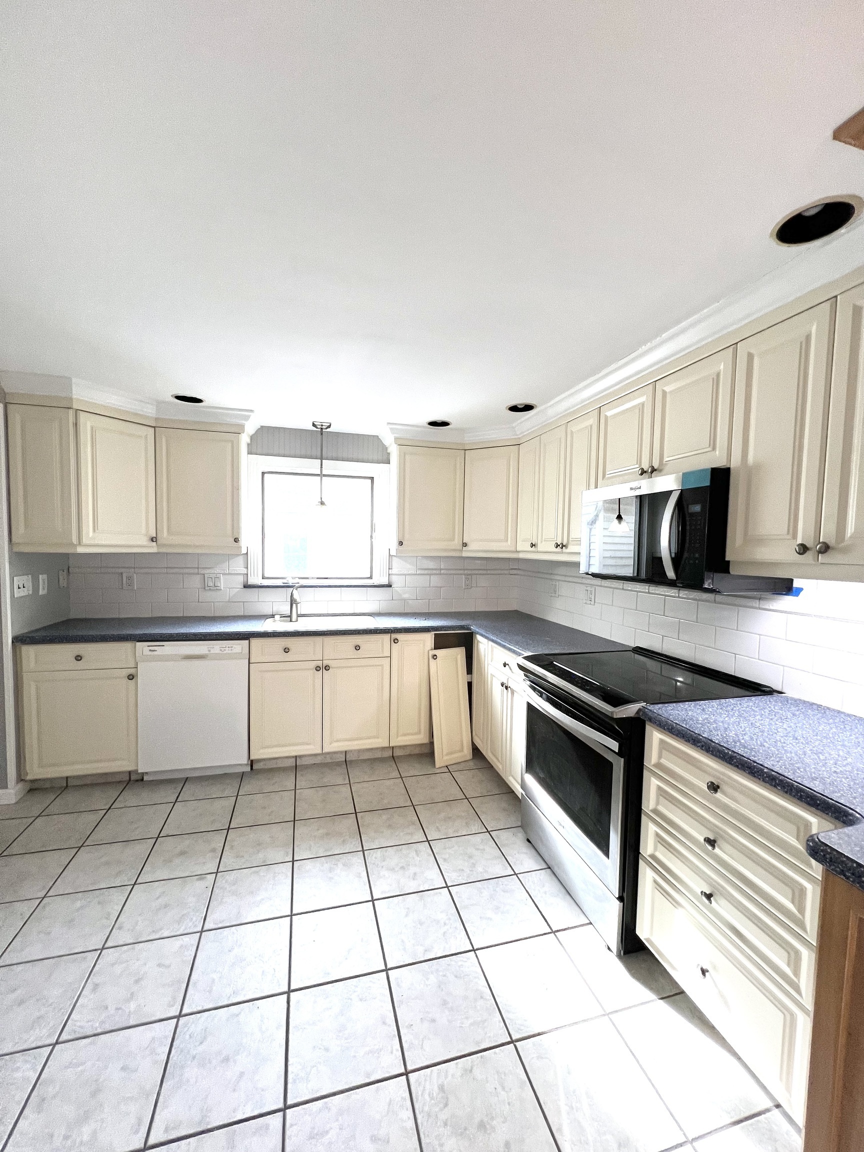 121 North State Street Ansonia, CT 06401 - Photo 18 of 37 a large kitchen with stainless steel appliances granite countertop a stove a sink and a refrigerator