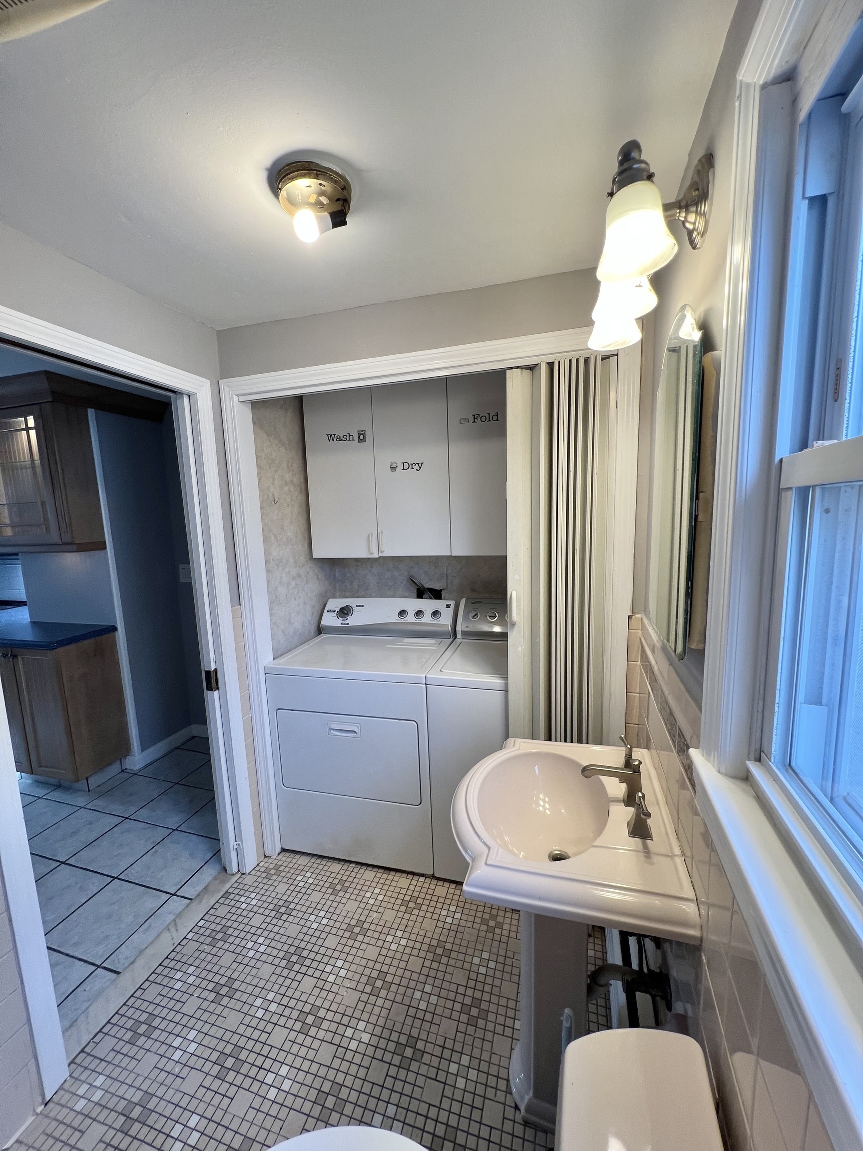 121 North State Street Ansonia, CT 06401 - Photo 23 of 37 a bathroom with a sink a toilet and mirror