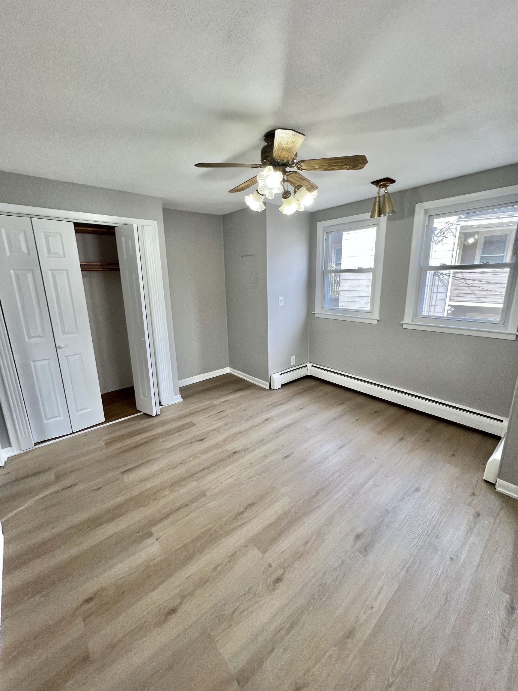 121 North State Street Ansonia, CT 06401 - Photo 27 of 37 a view of an empty room with wooden floor and a window