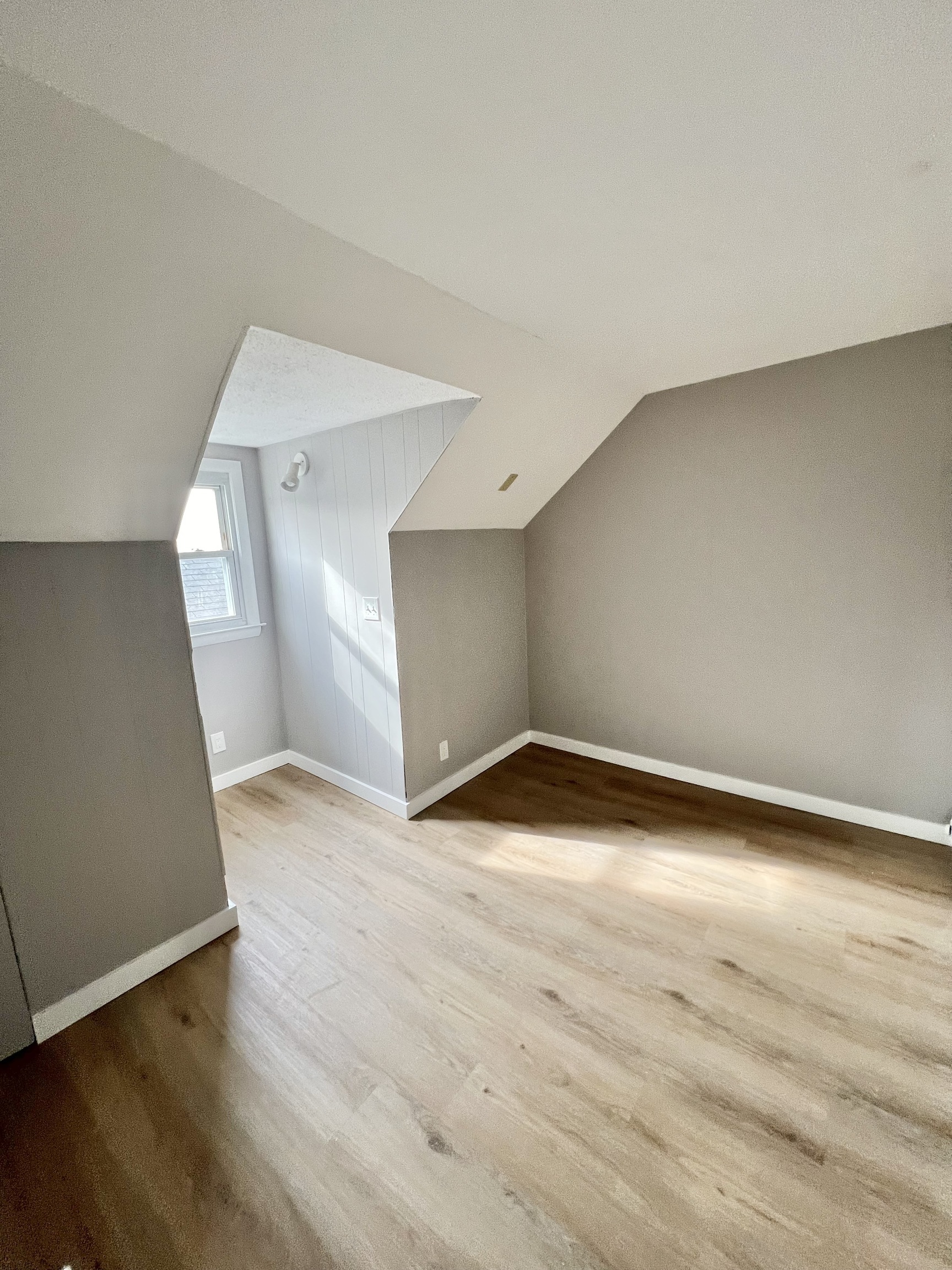 121 North State Street Ansonia, CT 06401 - Photo 34 of 37 an empty room with wooden floor and windows