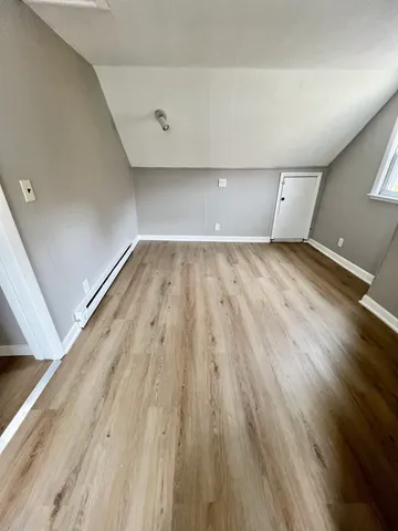 a bathroom with a toilet a sink and shower