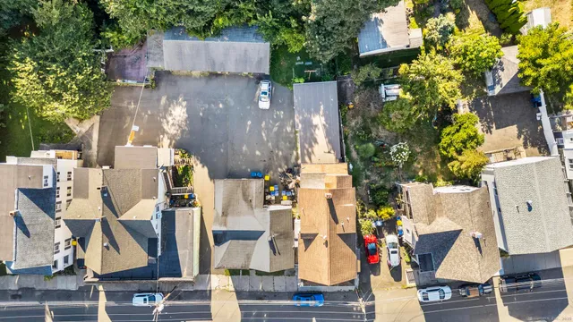an aerial view of houses with outdoor space