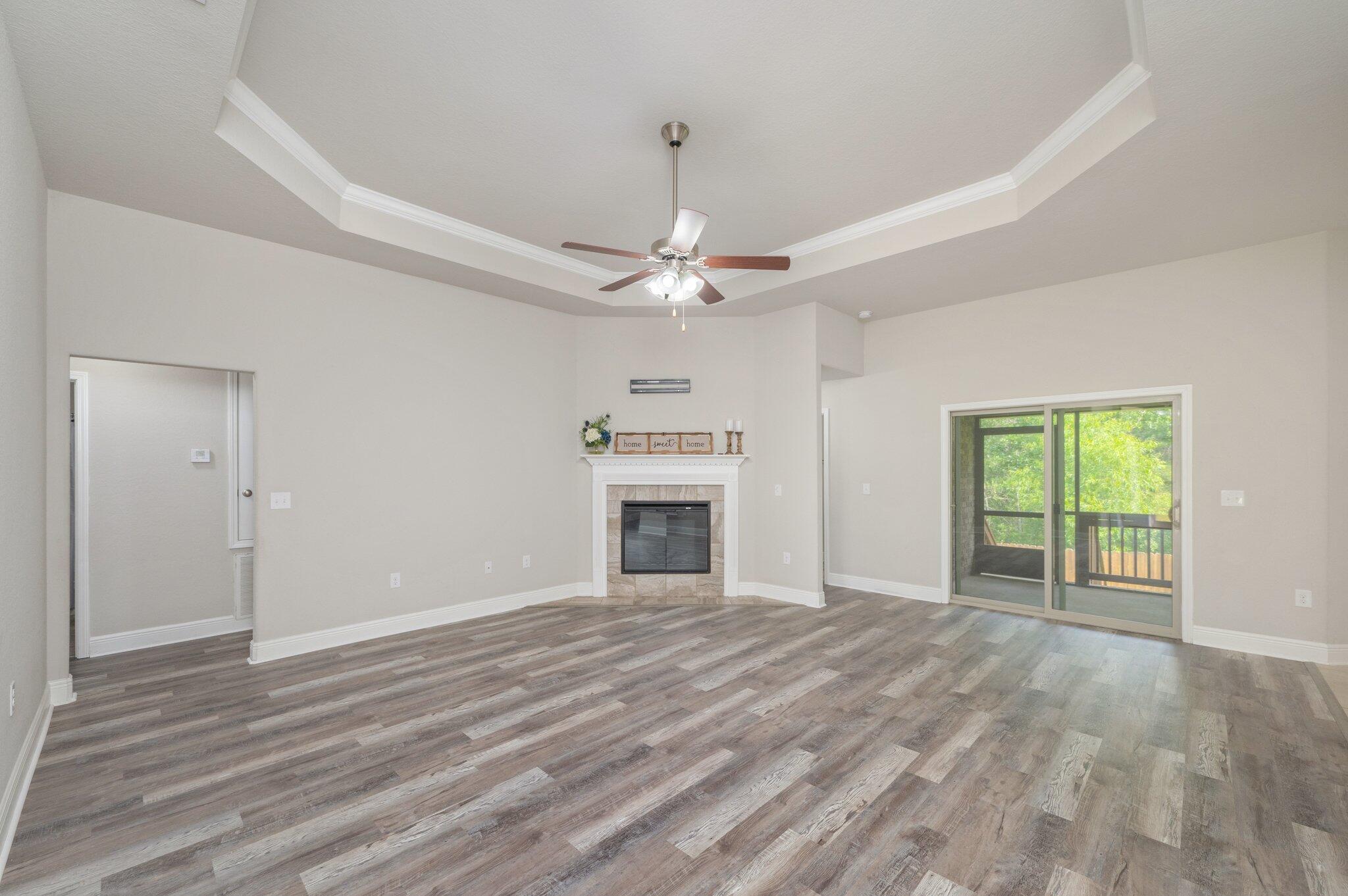 605 Terrier Trail Crestview, FL 32536 - Photo 11 of 46 a view of an empty room with a window and fireplace