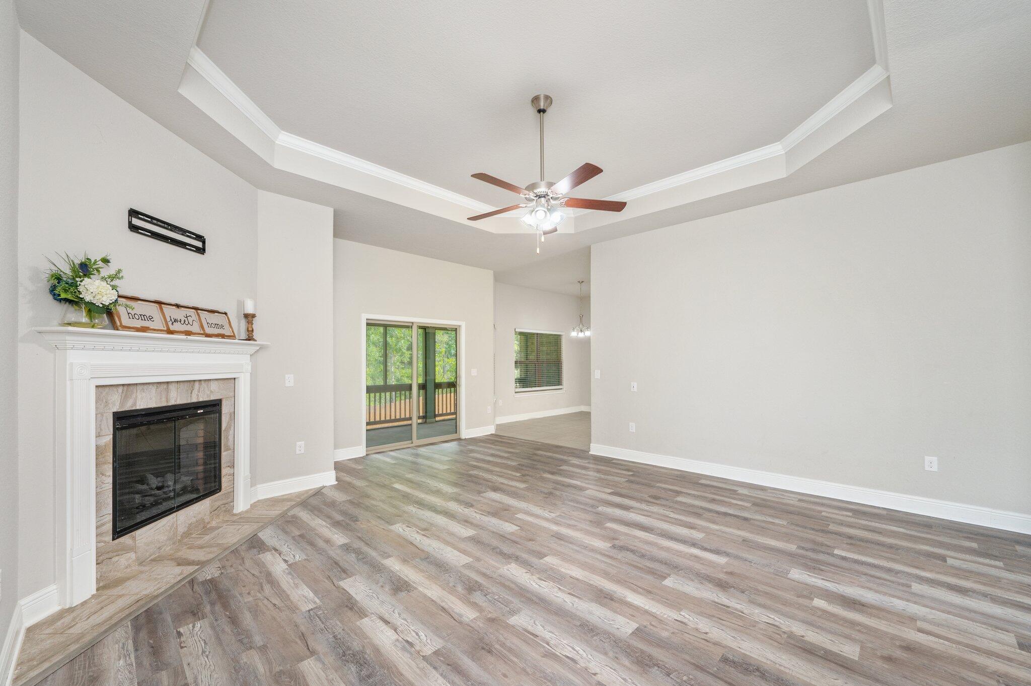 605 Terrier Trail Crestview, FL 32536 - Photo 12 of 46 a view of livingroom with window fireplace and ceiling fan