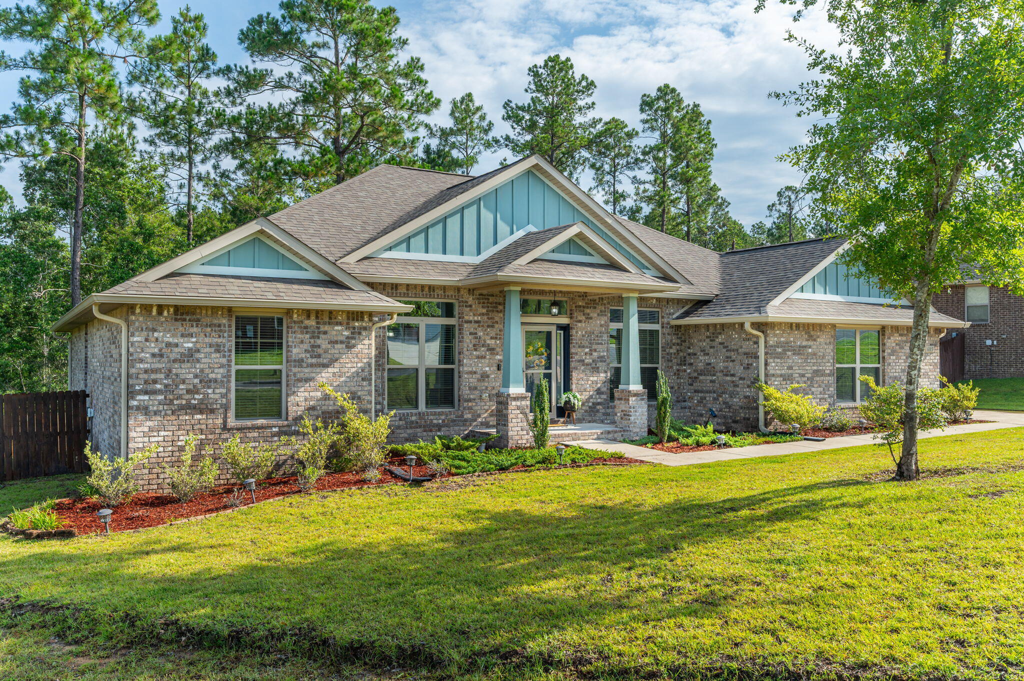 605 Terrier Trail Crestview, FL 32536 - Photo 2 of 46 a front view of a house with a yard