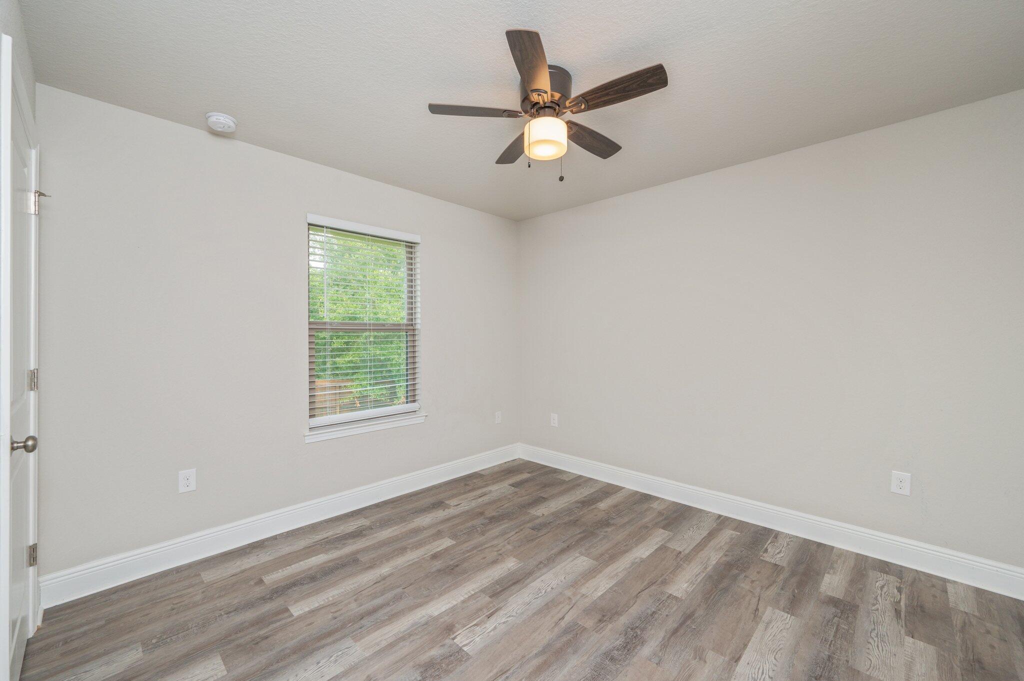 605 Terrier Trail Crestview, FL 32536 - Photo 30 of 46 an empty room with a window and a fan