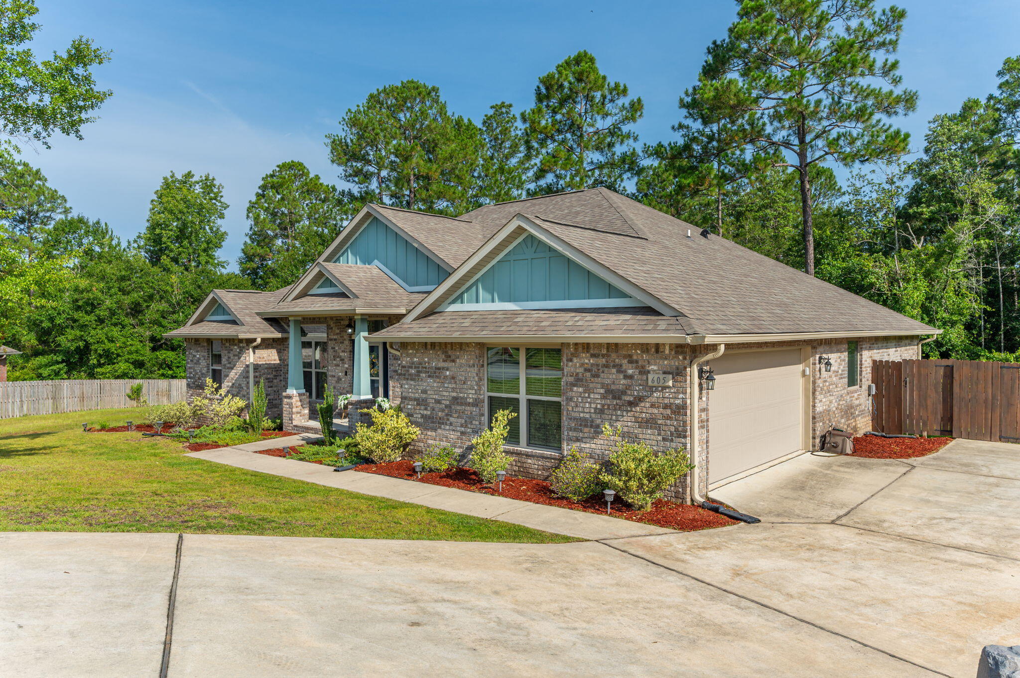 605 Terrier Trail Crestview, FL 32536 - Photo 3 of 46 a front view of a house with a yard