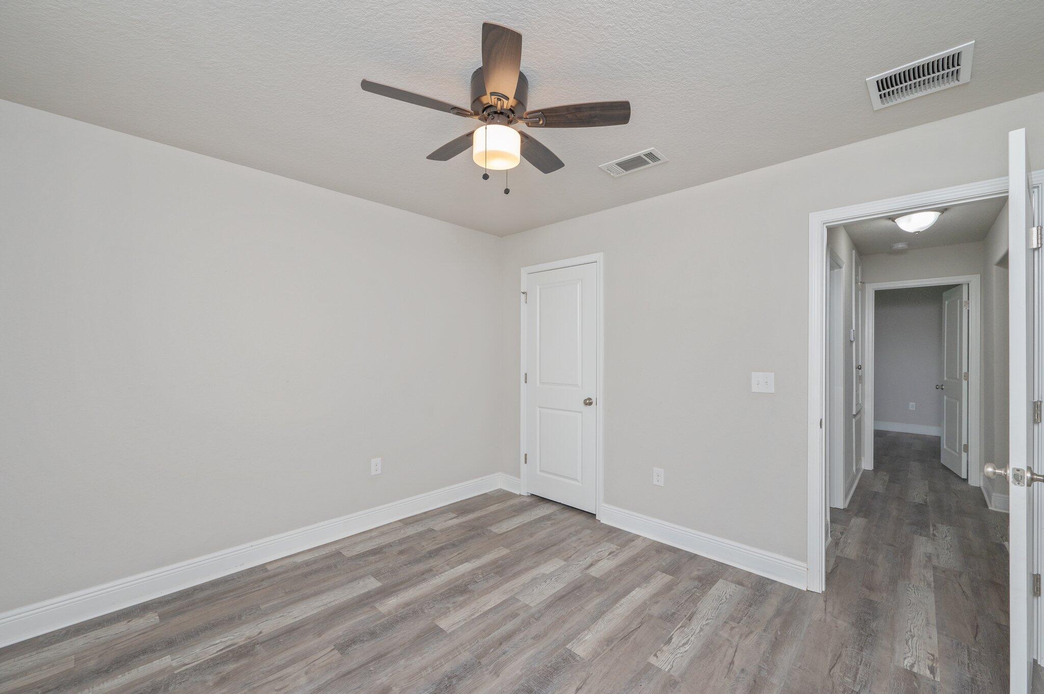 605 Terrier Trail Crestview, FL 32536 - Photo 34 of 46 wooden floor in an empty room