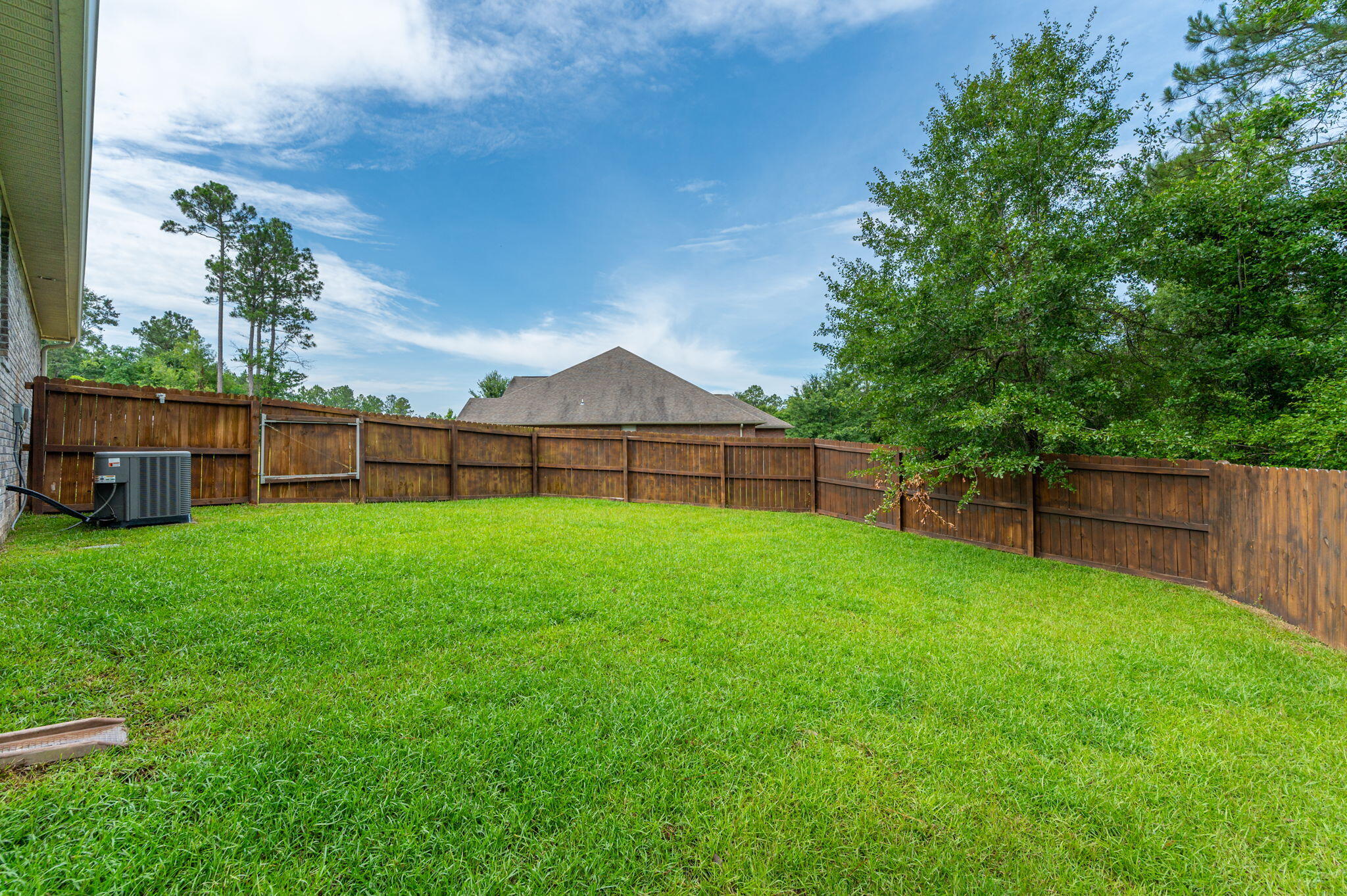605 Terrier Trail Crestview, FL 32536 - Photo 38 of 46 a view of a backyard with a garden