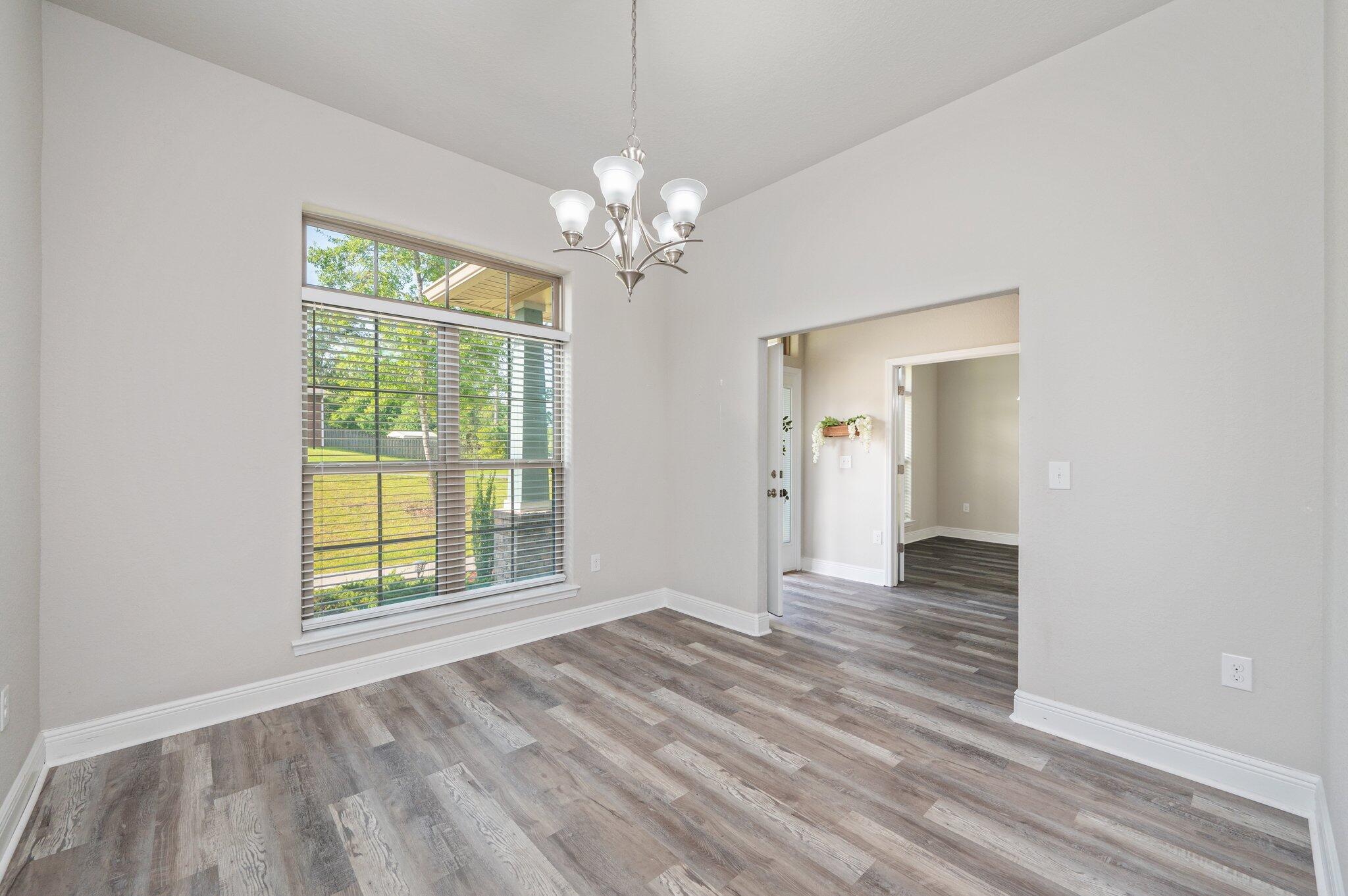 605 Terrier Trail Crestview, FL 32536 - Photo 7 of 46 a view of an empty room with a window