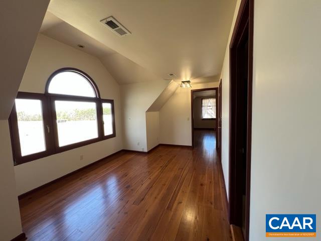 976 Douglas Church Road Farmville, VA 23901 - Photo 16 of 37 an empty room with wooden floor and windows