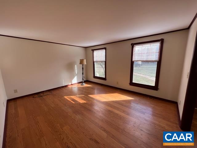 976 Douglas Church Road Farmville, VA 23901 - Photo 18 of 37 an empty room with wooden floor and windows