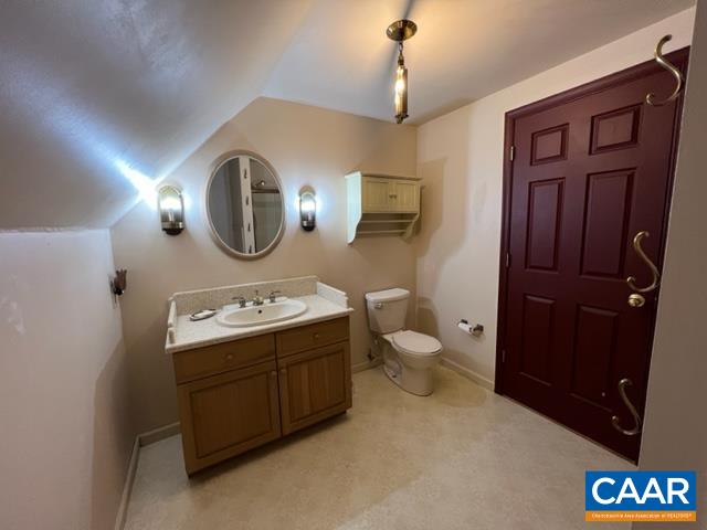 976 Douglas Church Road Farmville, VA 23901 - Photo 25 of 37 a bathroom with a toilet a sink and mirror