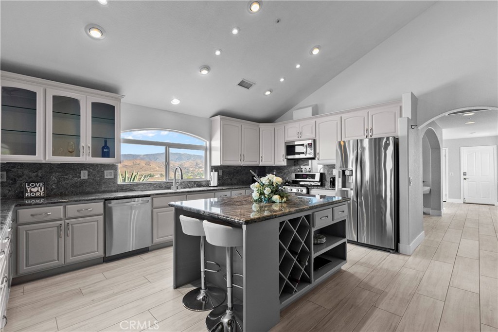 31800 Diamond View Lane Agua Dulce, CA 91390 - Photo 14 of 36 a kitchen with stainless steel appliances granite countertop a stove and a refrigerator
