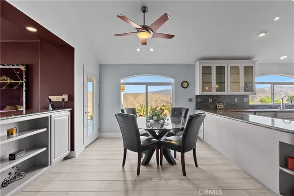 a dining room with furniture and window