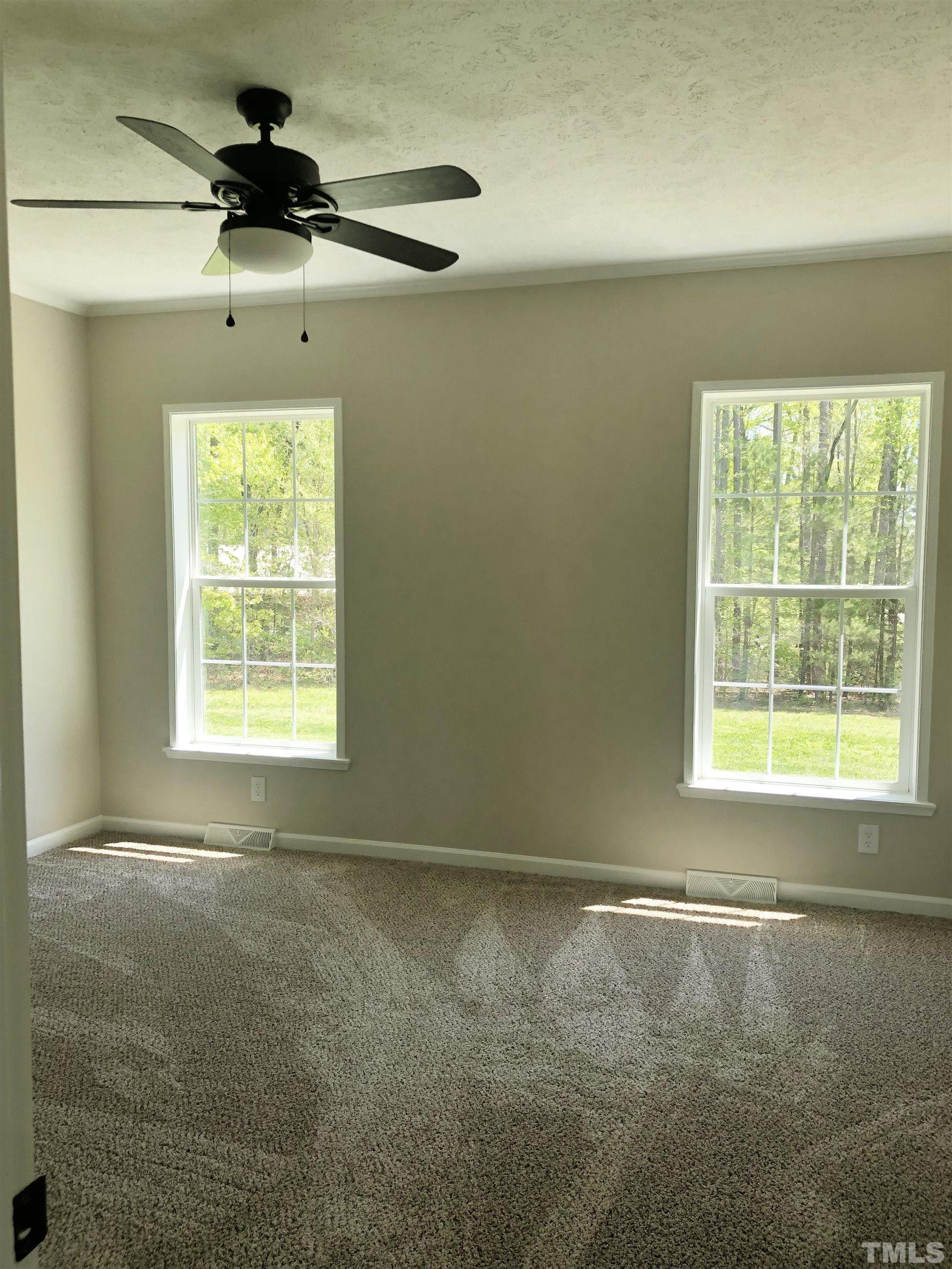 135 Satterfield Farm Road Timberlake, NC 27583 - Photo 11 of 37 a view of an empty room and a window