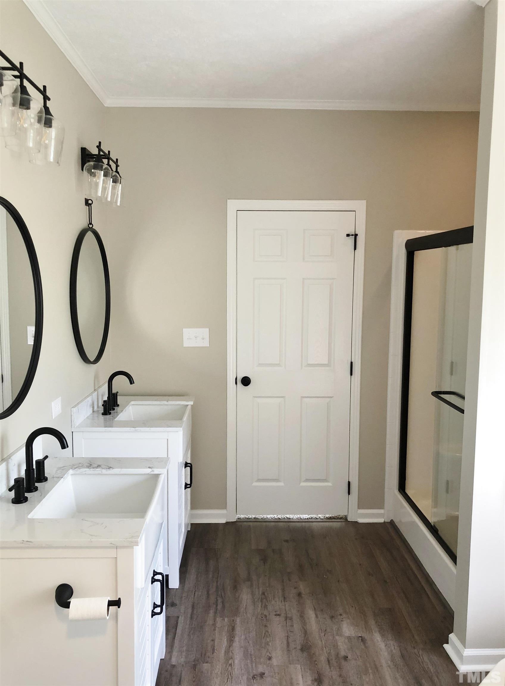 135 Satterfield Farm Road Timberlake, NC 27583 - Photo 17 of 37 a bathroom with a sink and a mirror