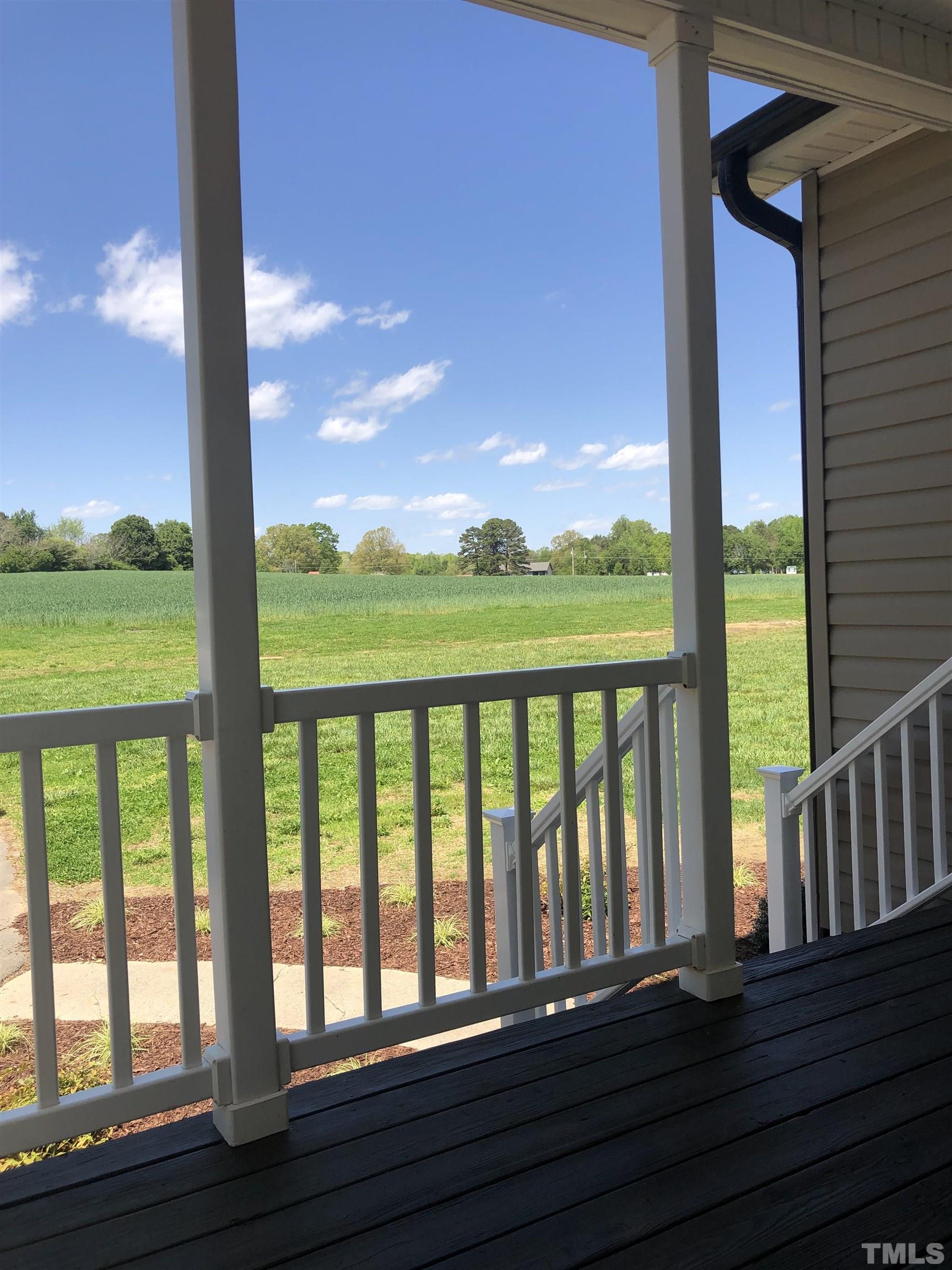135 Satterfield Farm Road Timberlake, NC 27583 - Photo 25 of 37 a view of roof deck with wooden floor and fence