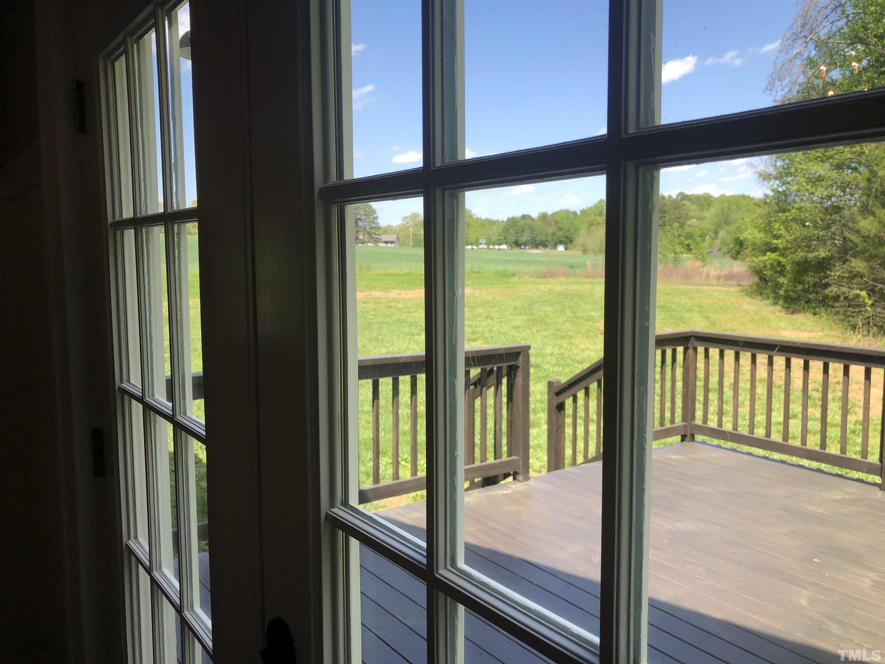 135 Satterfield Farm Road Timberlake, NC 27583 - Photo 26 of 37 a view of an empty room with wooden floor