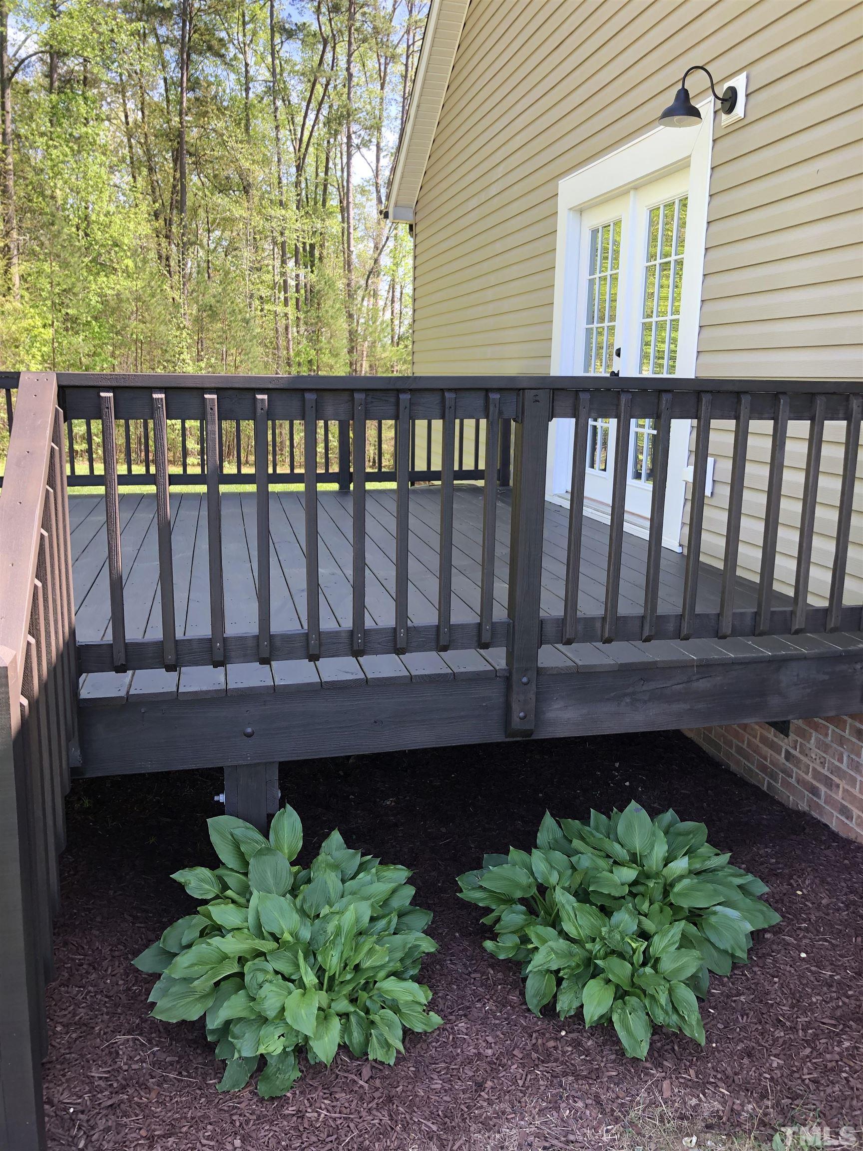 135 Satterfield Farm Road Timberlake, NC 27583 - Photo 28 of 37 a view of a small yard from a deck