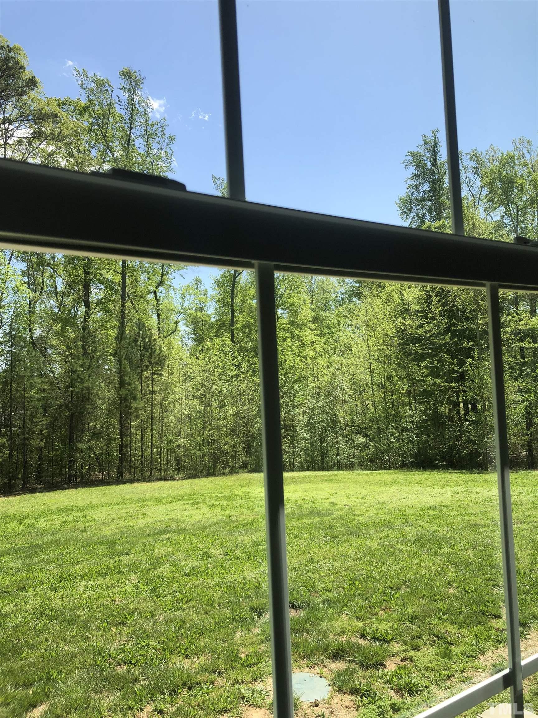 135 Satterfield Farm Road Timberlake, NC 27583 - Photo 29 of 37 a view of a garden from a window