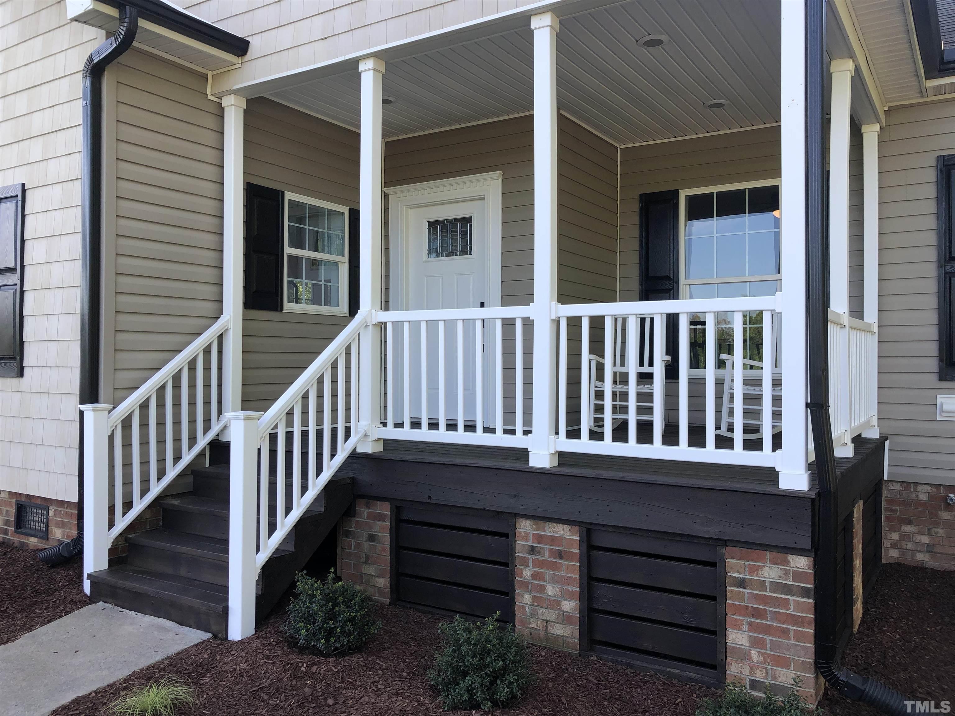 135 Satterfield Farm Road Timberlake, NC 27583 - Photo 31 of 37 a balcony with a bench