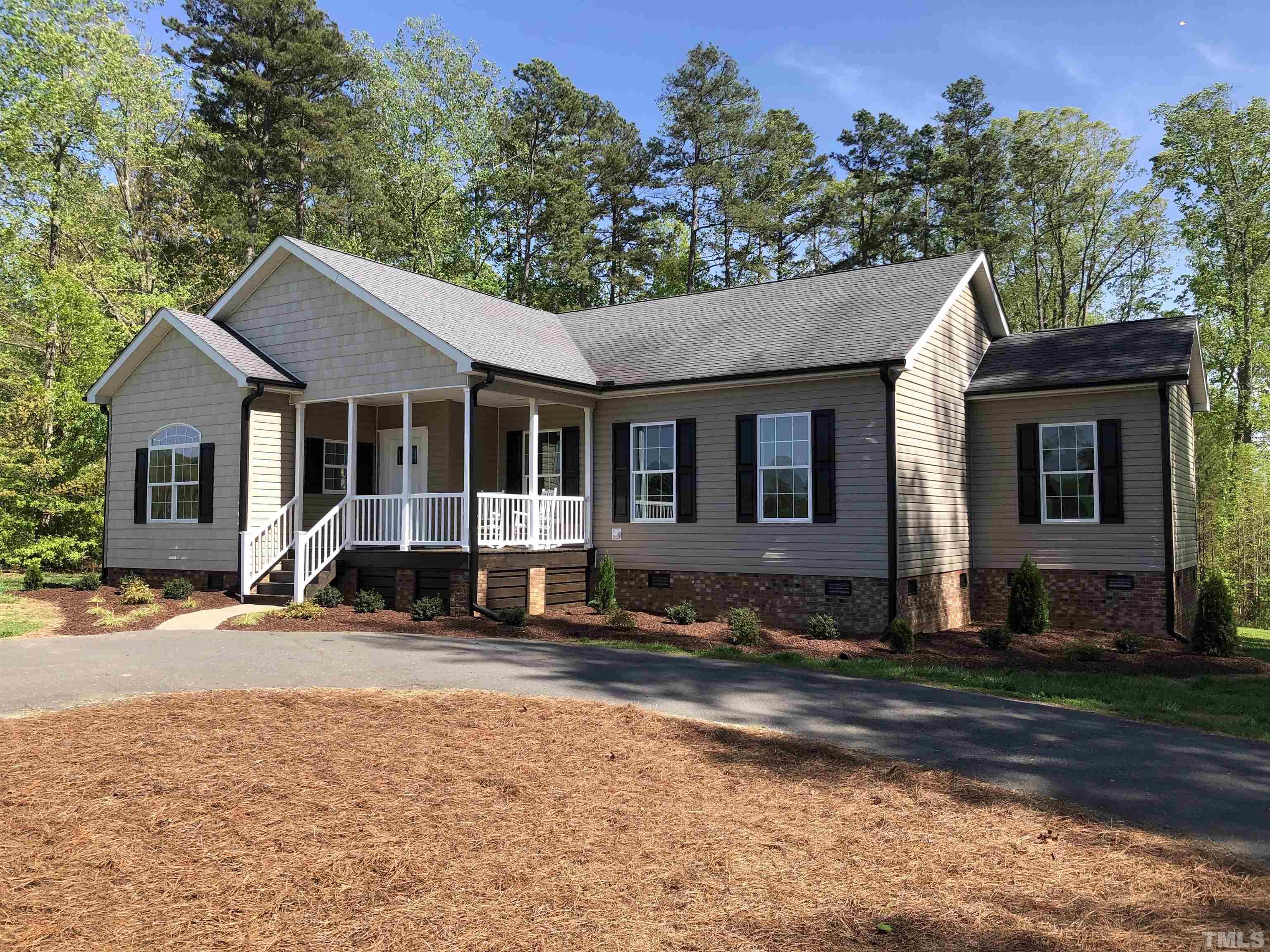 135 Satterfield Farm Road Timberlake, NC 27583 - Photo 33 of 37 a front view of a house with a yard