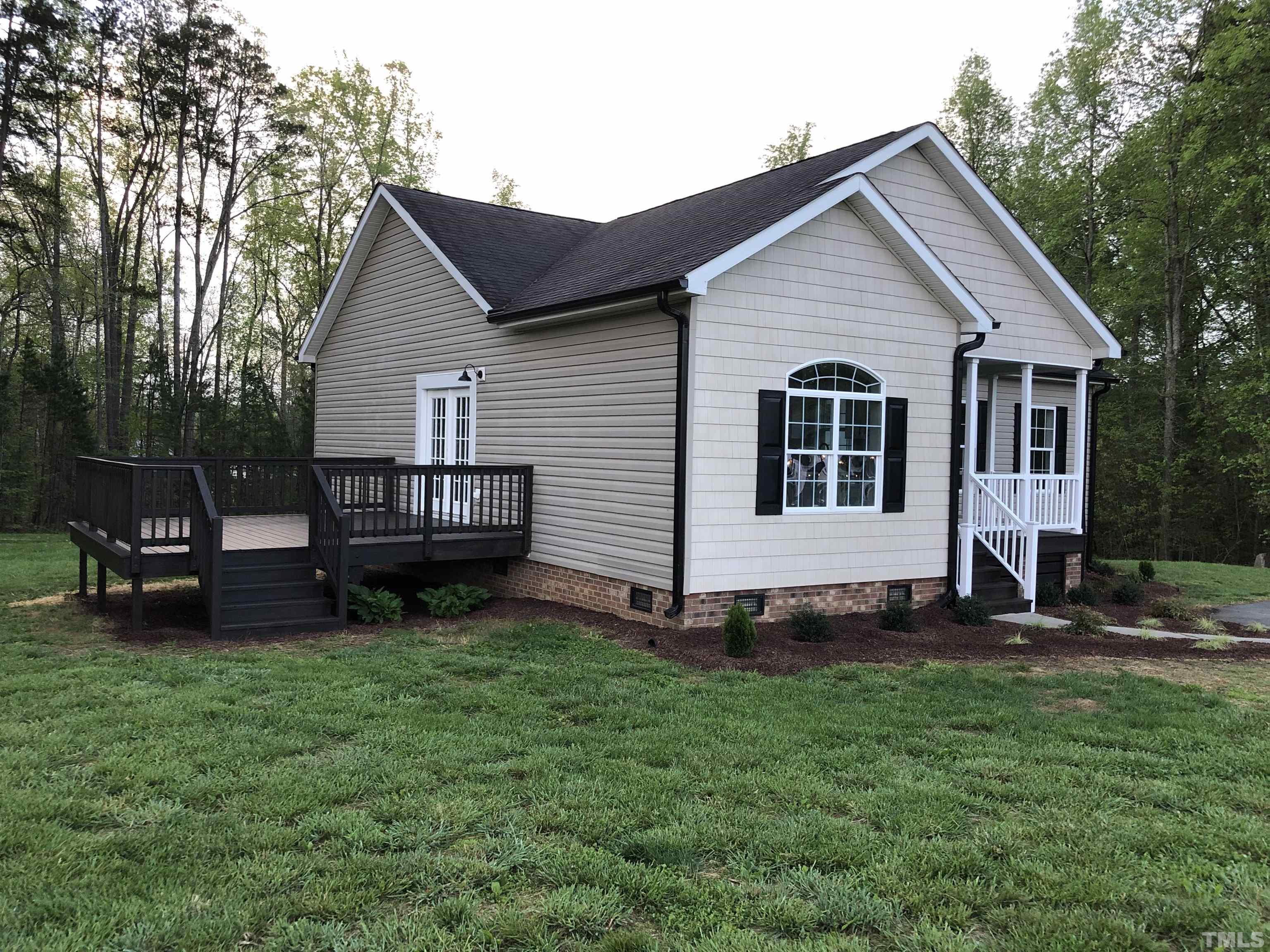 135 Satterfield Farm Road Timberlake, NC 27583 - Photo 34 of 37 a view of a house with a yard
