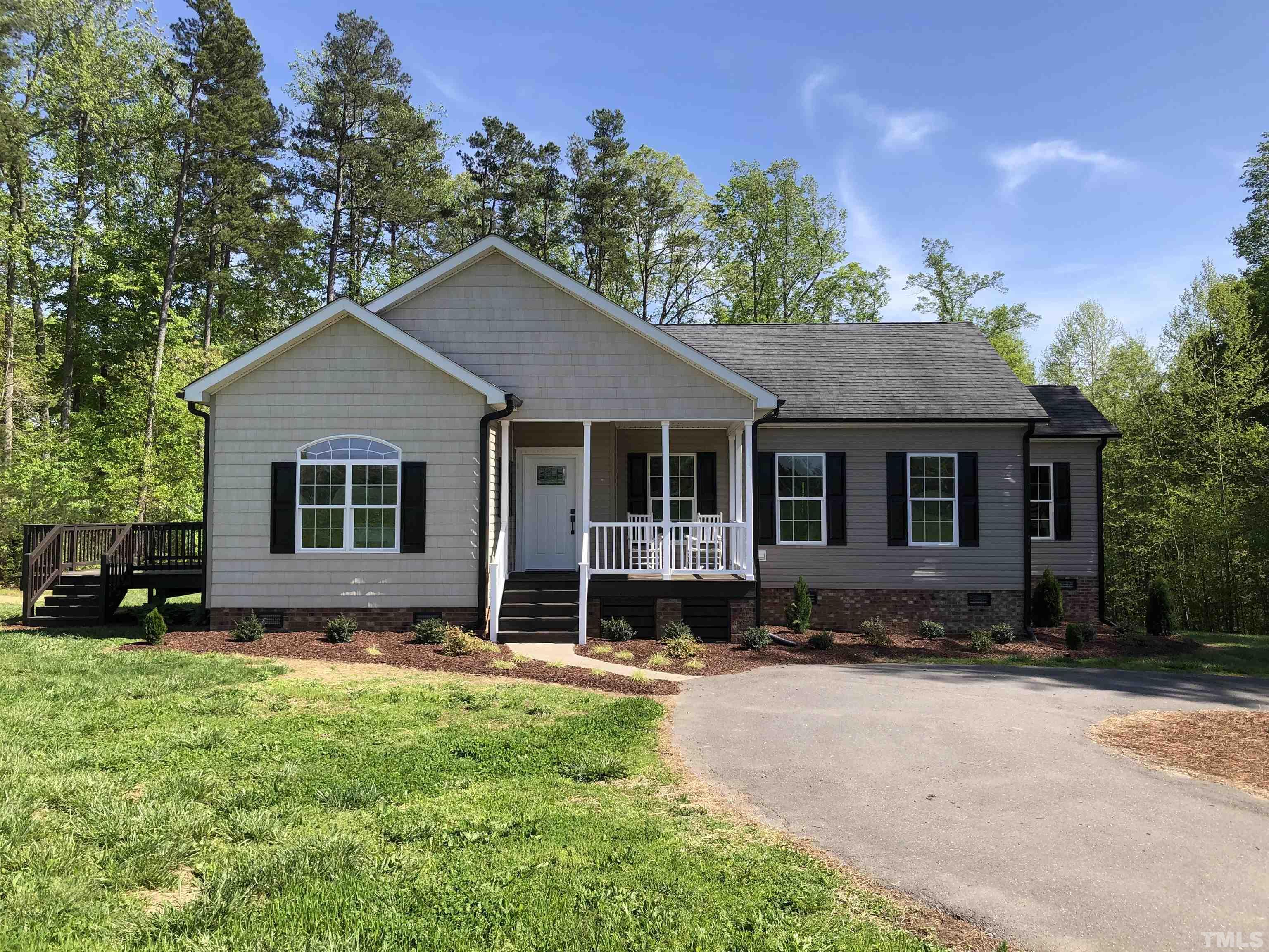 135 Satterfield Farm Road Timberlake, NC 27583 - Photo 36 of 37 a front view of a house with a yard