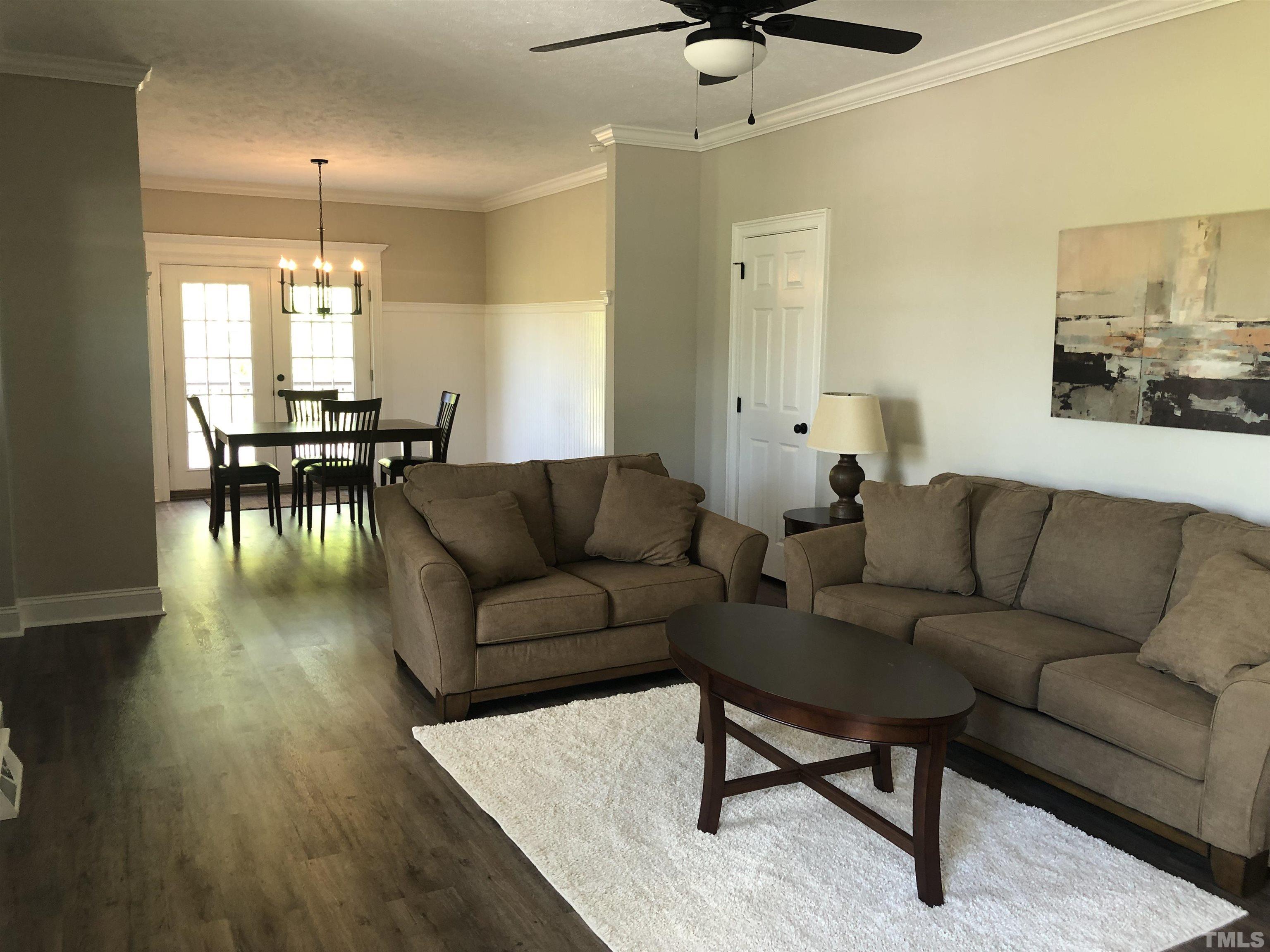135 Satterfield Farm Road Timberlake, NC 27583 - Photo 8 of 37 a living room with furniture and a large window