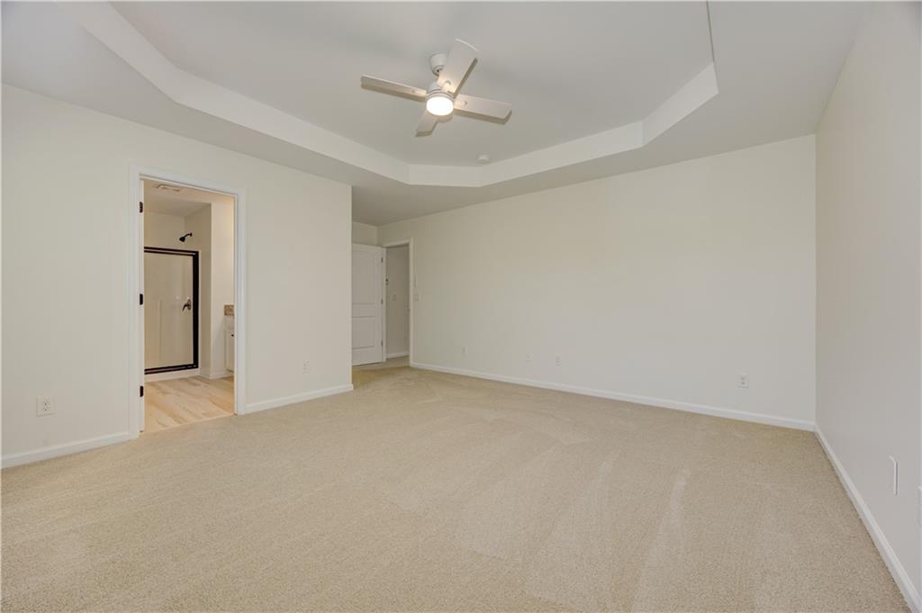 605 Summit Point Canton, GA 30114 - Photo 31 of 56 an empty room with closet and a ceiling fan