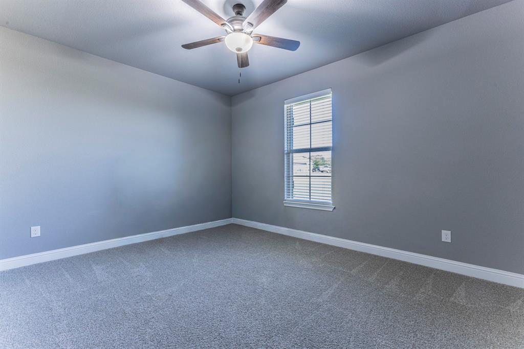 233 Fox Run Lane Robinson, TX 76706 - Photo 16 of 26 an empty room with a window and a fan