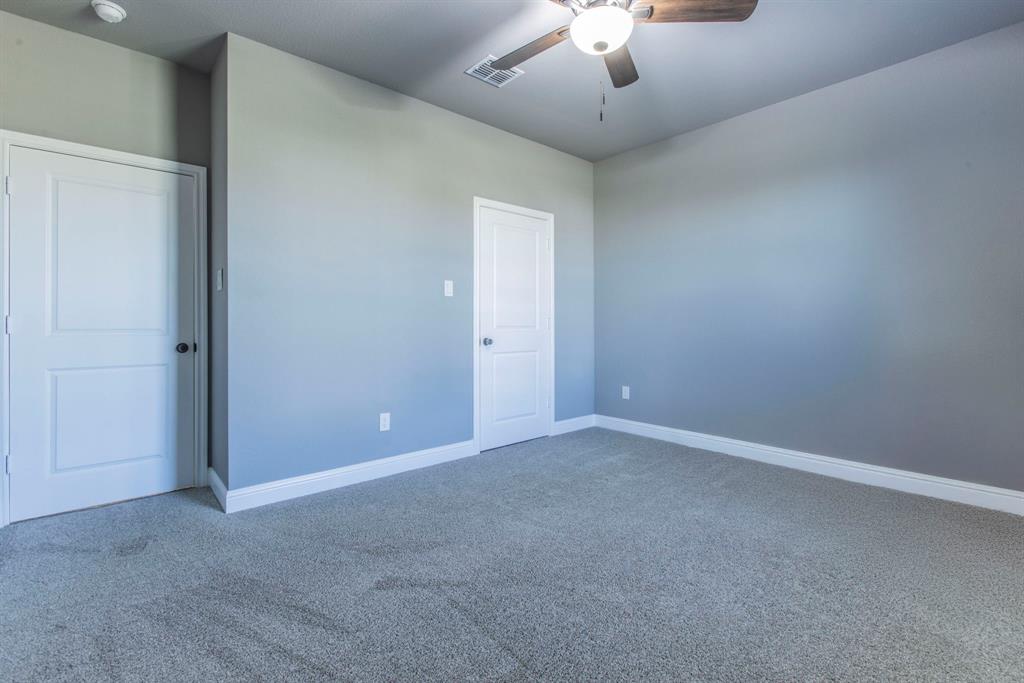 233 Fox Run Lane Robinson, TX 76706 - Photo 17 of 26 a view of an empty room with a chandelier fan