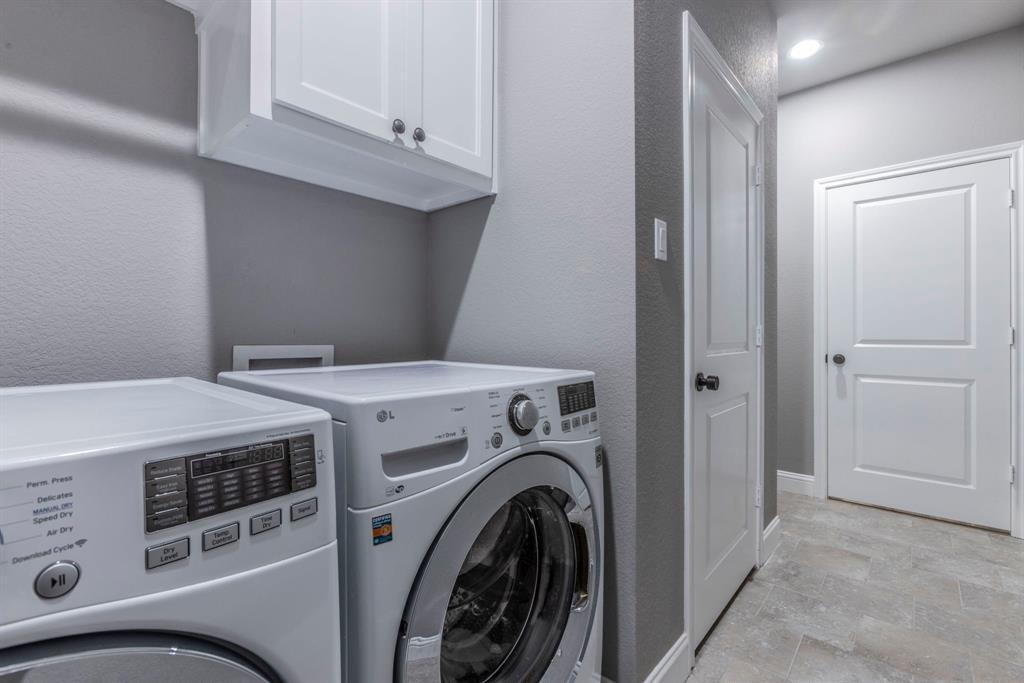 233 Fox Run Lane Robinson, TX 76706 - Photo 22 of 26 a utility room with dryer and washer