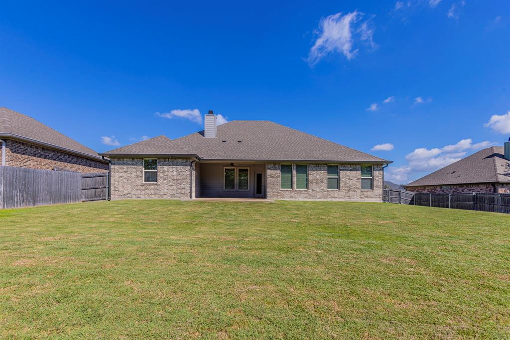 233 Fox Run Lane Robinson, TX 76706 - Photo 23 of 26 a house with yard in front of it