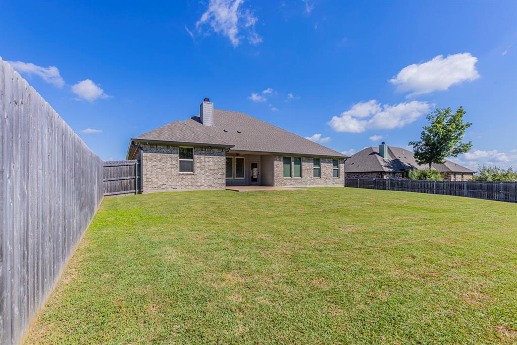 233 Fox Run Lane Robinson, TX 76706 - Photo 24 of 26 a front view of a house with a garden