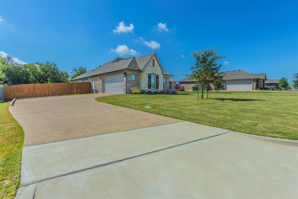 233 Fox Run Lane Robinson, TX 76706 - Photo 3 of 26 a house view with a garden space