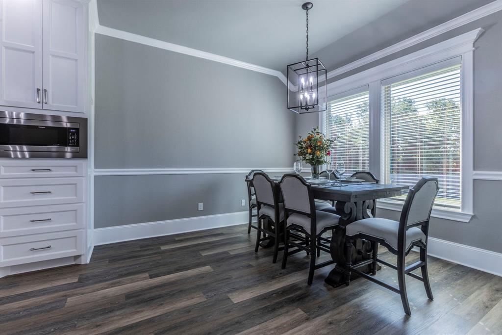 233 Fox Run Lane Robinson, TX 76706 - Photo 6 of 26 a view of a dining room with furniture window and wooden floor