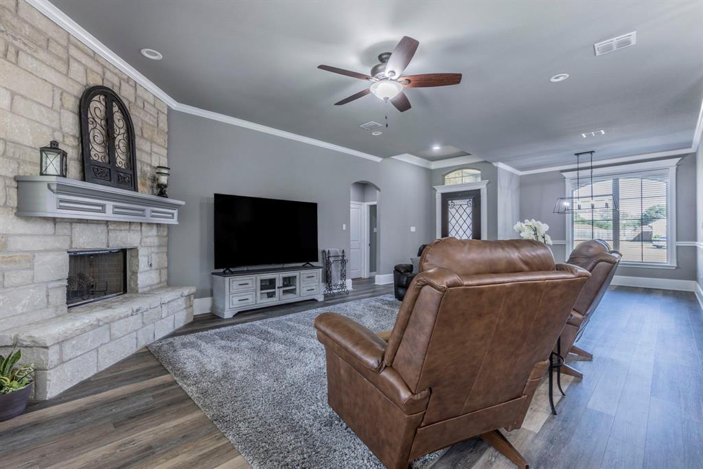 233 Fox Run Lane Robinson, TX 76706 - Photo 9 of 26 a living room with furniture and a flat screen tv