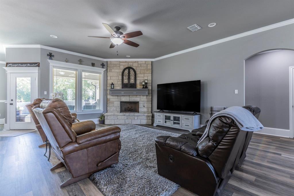 233 Fox Run Lane Robinson, TX 76706 - Photo 10 of 26 a living room with furniture and a flat screen tv