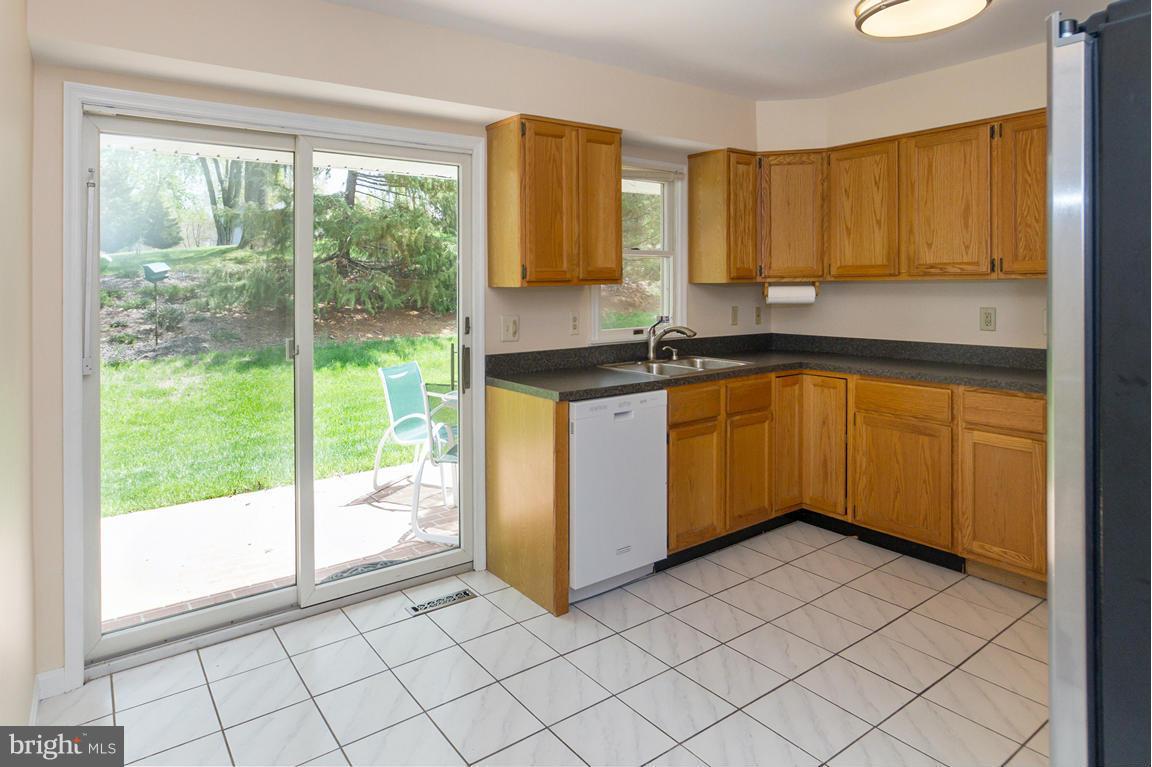 2209 Furnace Road Fallston, MD 21047 - Photo 11 of 30 a kitchen with stainless steel appliances granite countertop a stove a sink and a microwave