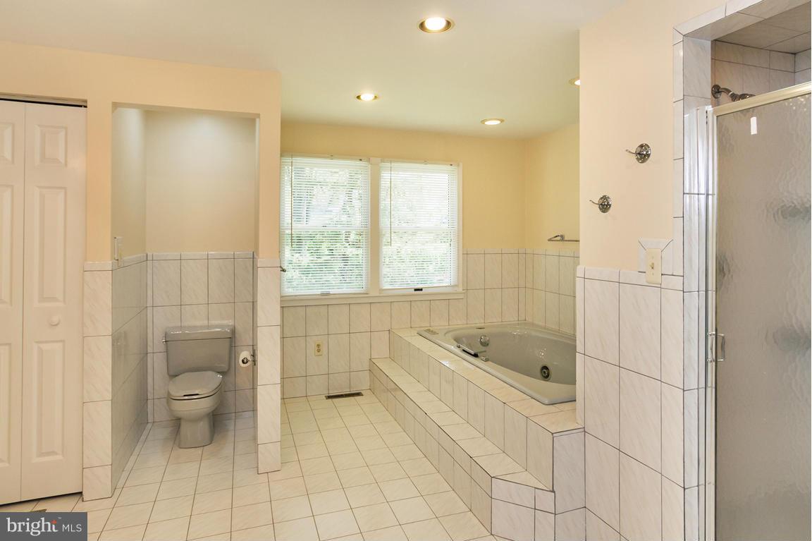 2209 Furnace Road Fallston, MD 21047 - Photo 18 of 30 a bathroom with a granite countertop sink a toilet and shower